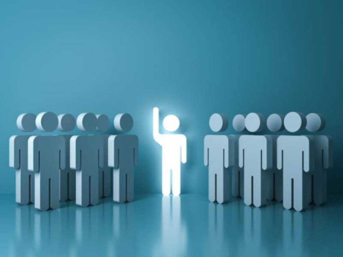 Stand out from the crowd and different concept , One glowing light man raising his hand among other people on light green pastel color background with reflections and shadows . 3D rendering. Stand out from the crowd and different concept , One glowing light man raising his hand among other people on light green pastel color background with reflections and shadows . 3D rendering.