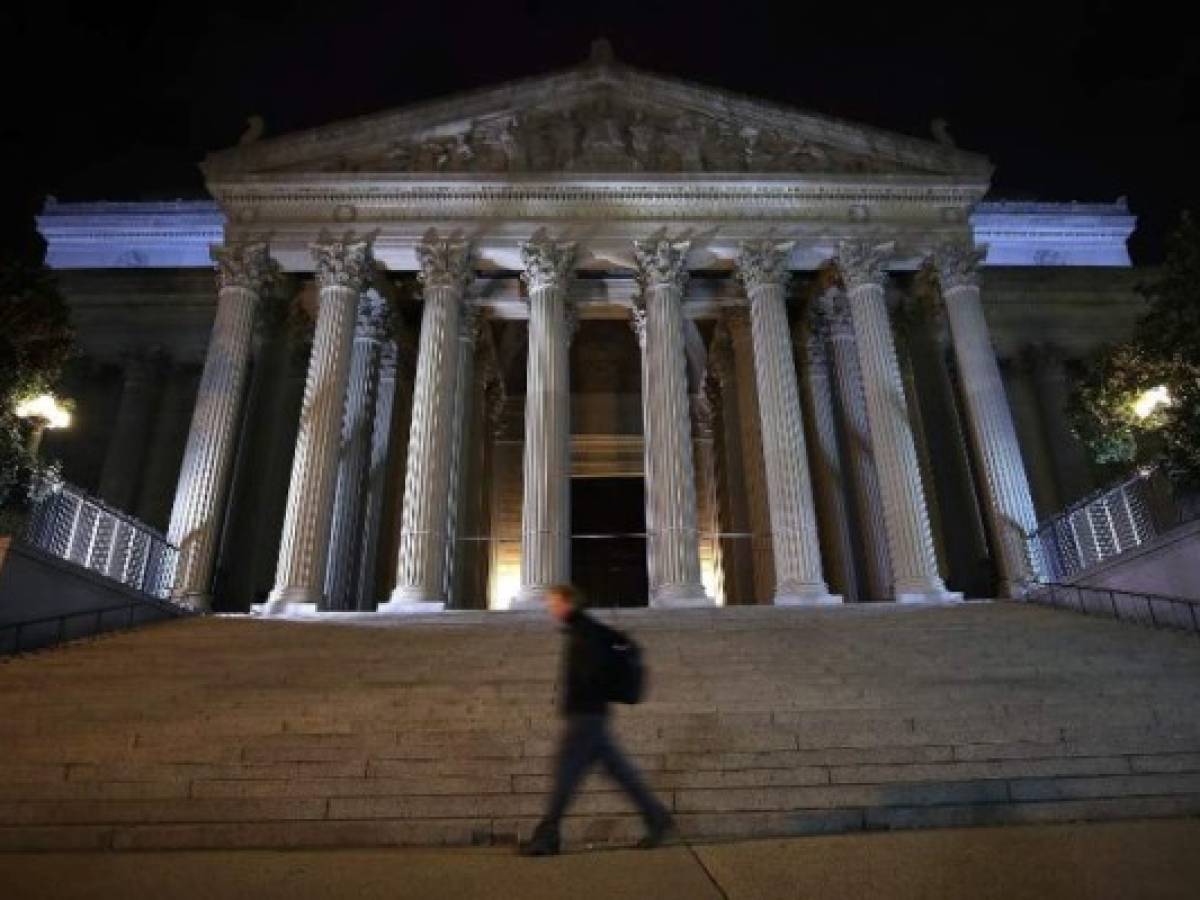 WASHINGTON, DC - OCTOBER 26: A man walks past the United States National Archives building on October 26, 2017 in Washington, DC. Later today the National Archives will release more than 3,000 classified files on the 1963 assassination of President John F. Kennedy. Mark Wilson/Getty Images/AFP WASHINGTON, DC - OCTOBER 26: A man walks past the United States National Archives building on October 26, 2017 in Washington, DC. Later today the National Archives will release more than 3,000 classified files on the 1963 assassination of President John F. Kennedy. Mark Wilson/Getty Images/AFP