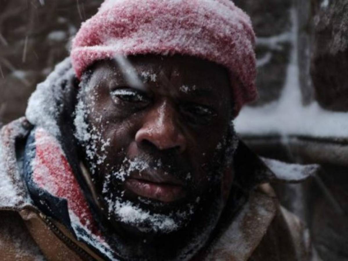 BOSTON, MA - JANUARY 04: George, who is homeless, pauses in a church alcove, on the streets of Boston as snow falls from a massive winter storm on January 4, 2018 in Boston, Massachusetts. Schools and businesses throughout the Boston area are closed as the city is expecting over a foot of snow and blizzard like conditions throughout the day. Spencer Platt/Getty Images/AFP