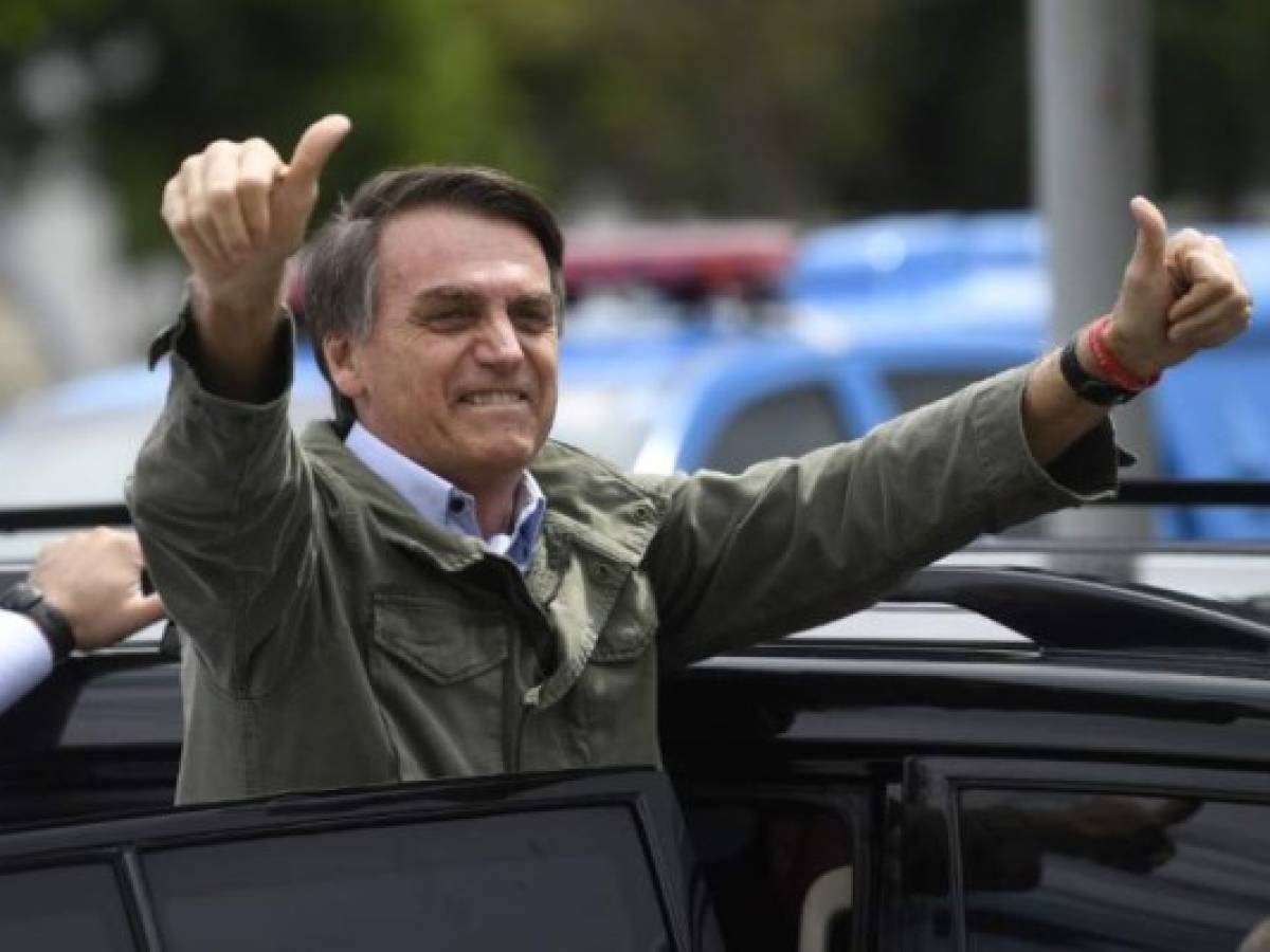 Brazilian President Jair Bolsonaro delivers a speech during the International Youth Day celebration at Planalto Palace in Brasilia on August 16, 2019. - Bolsonaro criticized a possible victory of Presidential candidate for the Frente de Todos (Front for All) party Alberto Fernandez in the upcoming elections in Argentina. (Photo by EVARISTO SA / AFP)