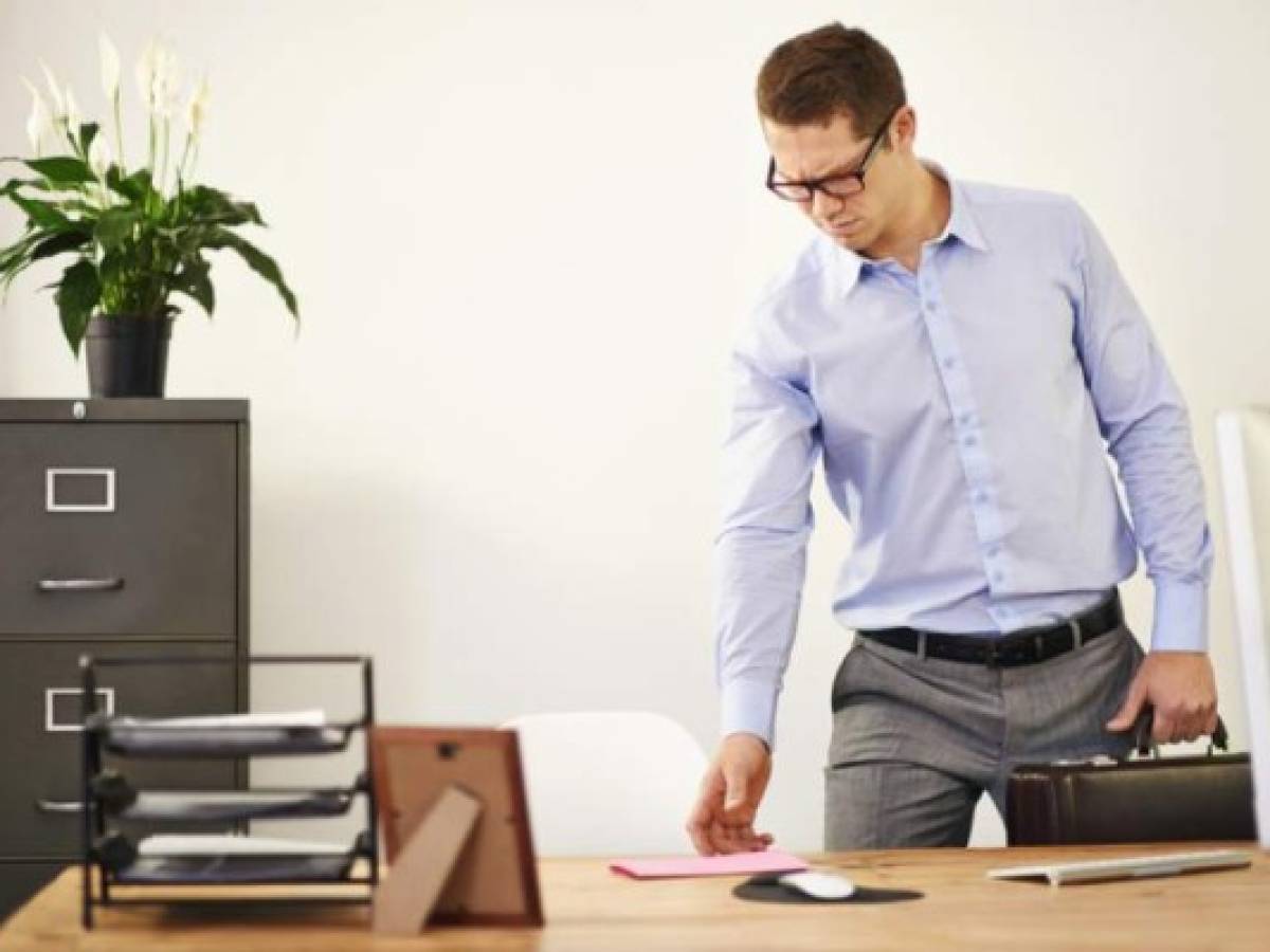 A young businessman finding a pink slip on his deskhttp://195.154.178.81/DATA/i_collage/pi/shoots/783398.jpg A young businessman finding a pink slip on his deskhttp://195.154.178.81/DATA/i_collage/pi/shoots/783398.jpg