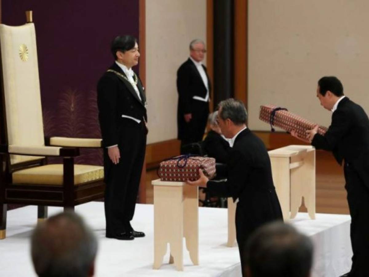 Japans new Emperor Naruhito (top-L) attends a ceremony to inherit the imperial regalia and seals at the Matsu-no-Ma state room inside the Imperial Palace in Tokyo on May 1, 2019. - Japan's new Emperor Naruhito formally ascended the Chrysanthemum Throne on May 1, a day after his father abdicated from the world's oldest monarchy and ushered in a new imperial era. (Photo by STR / various sources / AFP) / Japan OUT / NO SALES - No Archives Japans new Emperor Naruhito (top-L) attends a ceremony to inherit the imperial regalia and seals at the Matsu-no-Ma state room inside the Imperial Palace in Tokyo on May 1, 2019. - Japan's new Emperor Naruhito formally ascended the Chrysanthemum Throne on May 1, a day after his father abdicated from the world's oldest monarchy and ushered in a new imperial era. (Photo by STR / various sources / AFP) / Japan OUT / NO SALES - No Archives