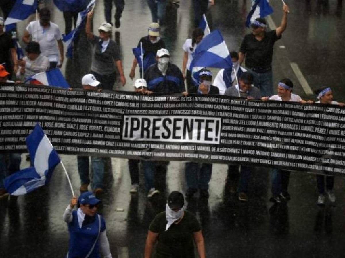 Nicaraguan opposition demonstrators take part in a nationwide march called 'United We Are a Volcano' in Managua on July 12, 2018.Opposition activists are steeling themselves for three days of protests against Nicaragua President Daniel Ortega, as fears mount over the brutal suppresion of dissent by government forces. Demonstrators marched through the capital Managua on Thursday before a general strike on Friday and a tour of Managua's most restive neighborhoods on Saturday. / AFP PHOTO / Marvin RECINOS Nicaraguan opposition demonstrators take part in a nationwide march called 'United We Are a Volcano' in Managua on July 12, 2018.Opposition activists are steeling themselves for three days of protests against Nicaragua President Daniel Ortega, as fears mount over the brutal suppresion of dissent by government forces. Demonstrators marched through the capital Managua on Thursday before a general strike on Friday and a tour of Managua's most restive neighborhoods on Saturday. / AFP PHOTO / Marvin RECINOS