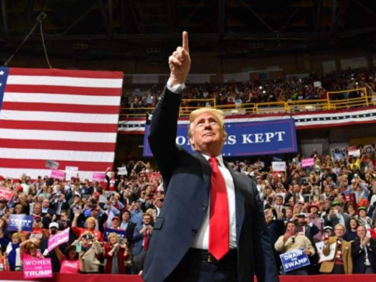 US President Donald Trump arrives for a 'Make America Great Again' campaign rally at McKenzie Arena, in Chattanooga, Tennessee on November 4, 2018. (Photo by Nicholas Kamm / AFP) US President Donald Trump arrives for a 'Make America Great Again' campaign rally at McKenzie Arena, in Chattanooga, Tennessee on November 4, 2018. (Photo by Nicholas Kamm / AFP)