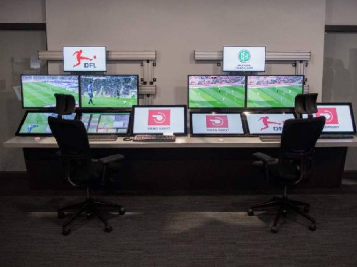 (FILES) In this file photo taken on July 20, 2017 shows the video assist centre (Videoassistcenter, VAR) in Cologne, western Germany, where scenes in German Bundesliga football matches are reviewed.The management of the 32 teams qualified for the World Cup-2018 in Russia were rather confident February 28 about the video assistance to the arbitration (VAR), whose Fifa must decide March 3 of the use during the competition. / AFP PHOTO / dpa / Rolf Vennenbernd / Germany OUT