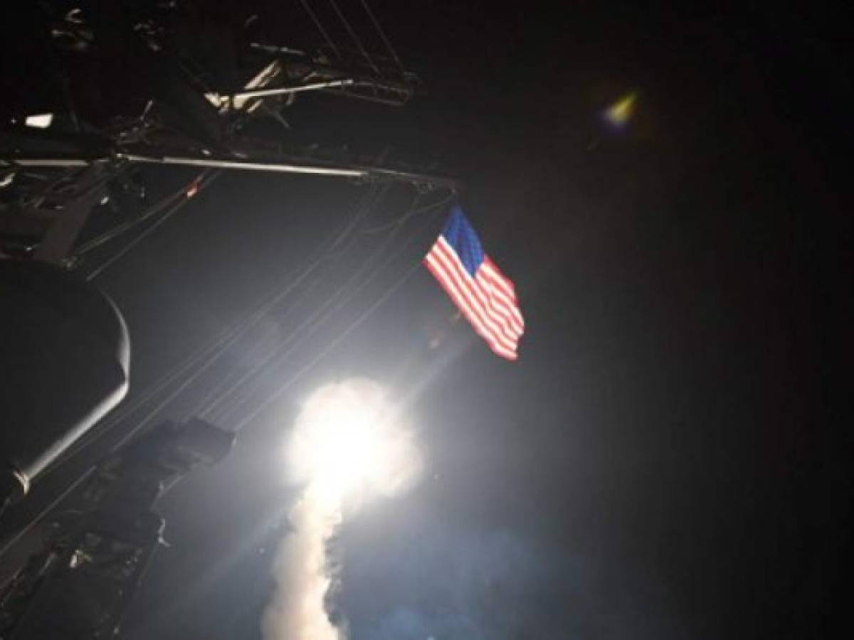 In this image released by the US Navy, the guided-missile destroyer USS Porter conducts strike operations while in the Mediterranean Sea, April 7, 2017. US President Donald Trump ordered a massive military strike on a Syrian air base on Thursday in retaliation for a 'barbaric' chemical attack he blamed on President Bashar al-Assad. The missiles were fired from the USS Porter and the USS Ross, which belong to the US Navy's Sixth Fleet and are located in the eastern Mediterranean. / AFP PHOTO / US NAVY / Ford WILLIAMS / RESTRICTED TO EDITORIAL USE - MANDATORY CREDIT 'AFP PHOTO / US NAVY / Mass Communication Specialist 3rd Class Ford Williams' - NO MARKETING NO ADVERTISING CAMPAIGNS - DISTRIBUTED AS A SERVICE TO CLIENTS