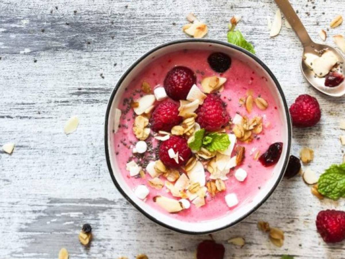 Raspberry Smoothie Bowl / Healthy breakfast concept, selective focus