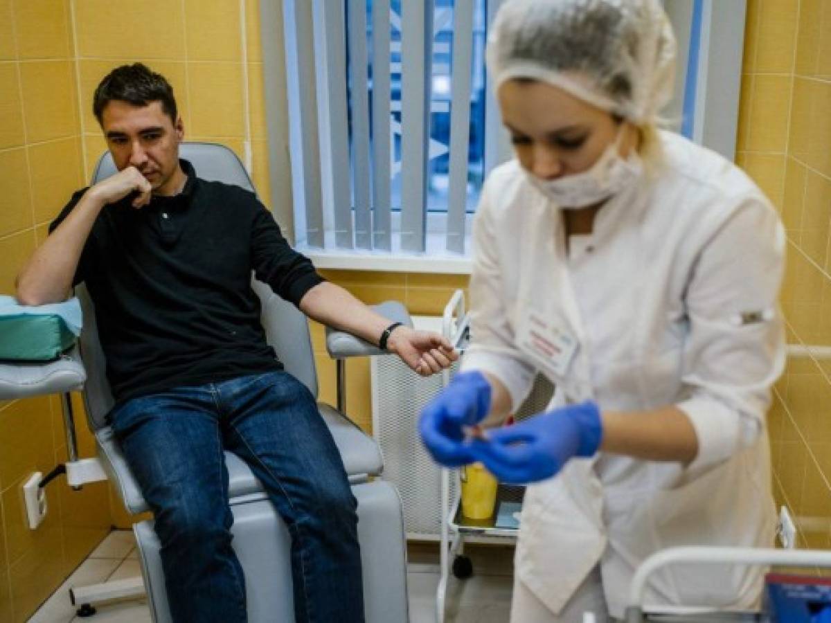 Entrepreneur Stanislav Skakun, 36, has his blood taken for analysis at a private clinic in Moscow on November 28, 2019. - Some add chips to their hands to open doors or start cars, others hope to live longer through intensive monitoring of their bodies. They are biohackers, people who seek to 'upgrade' their bodies with experimental technology and DIY health fixes. In Russia, the movement is spreading, with social media forums, conferences and businesses springing up to cater to their needs. (Photo by Dimitar DILKOFF / AFP)