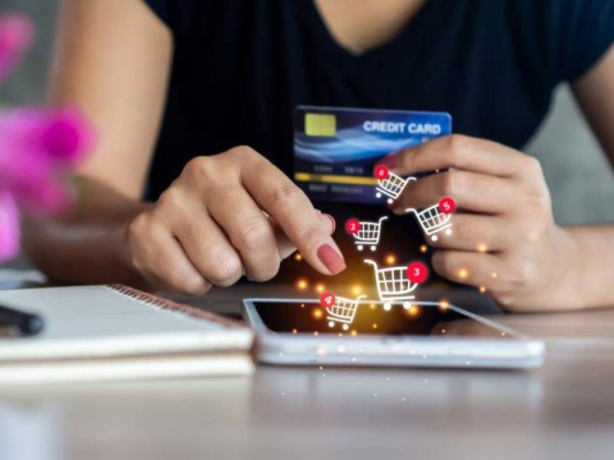 closeup woman hand holding smart phone and credit card to order, shopping online