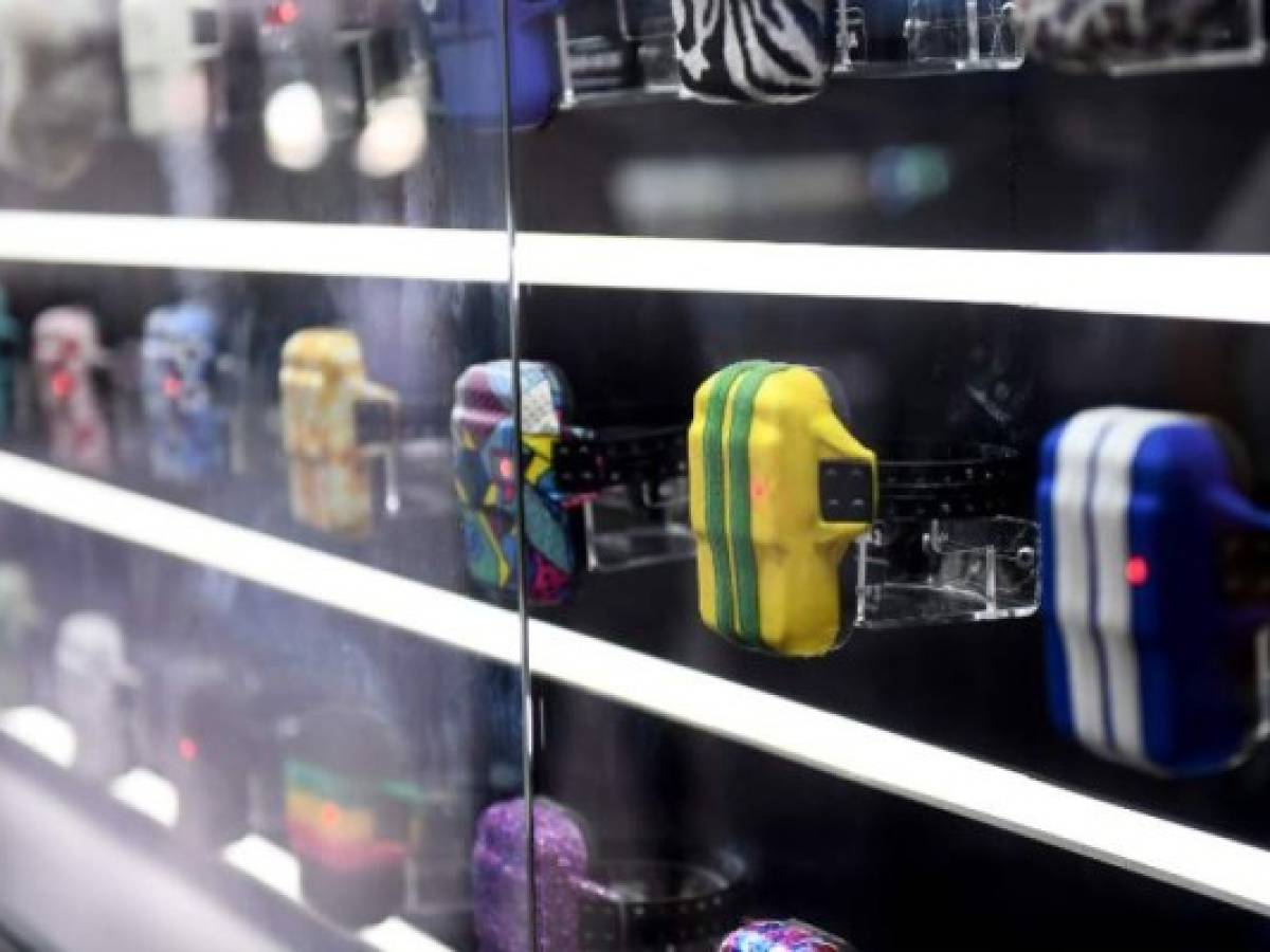 Ankle monitors' cases in a variety of patterns are displayed at the 'Corruption Shop', a kiosk at Brasilia's Airport set up to promote the new Netflix series 'The Mechanism' (O Mecanismo), based on Brazil's mammoth 'Car Wash' graft scandal, on March 28, 2018. The kiosk which is part of an advertising campaign to promote 'O Mecanismo', a Brazilian drama series based on 'Lava Jato' (Car Wash), the largest anti-corruption investigation in Brazil's history, that involves private and state-owned oil and construction companies -on air since March 23, 2018- displays items which supposedly facilitate the life of corrupt persons. / AFP PHOTO / EVARISTO SA