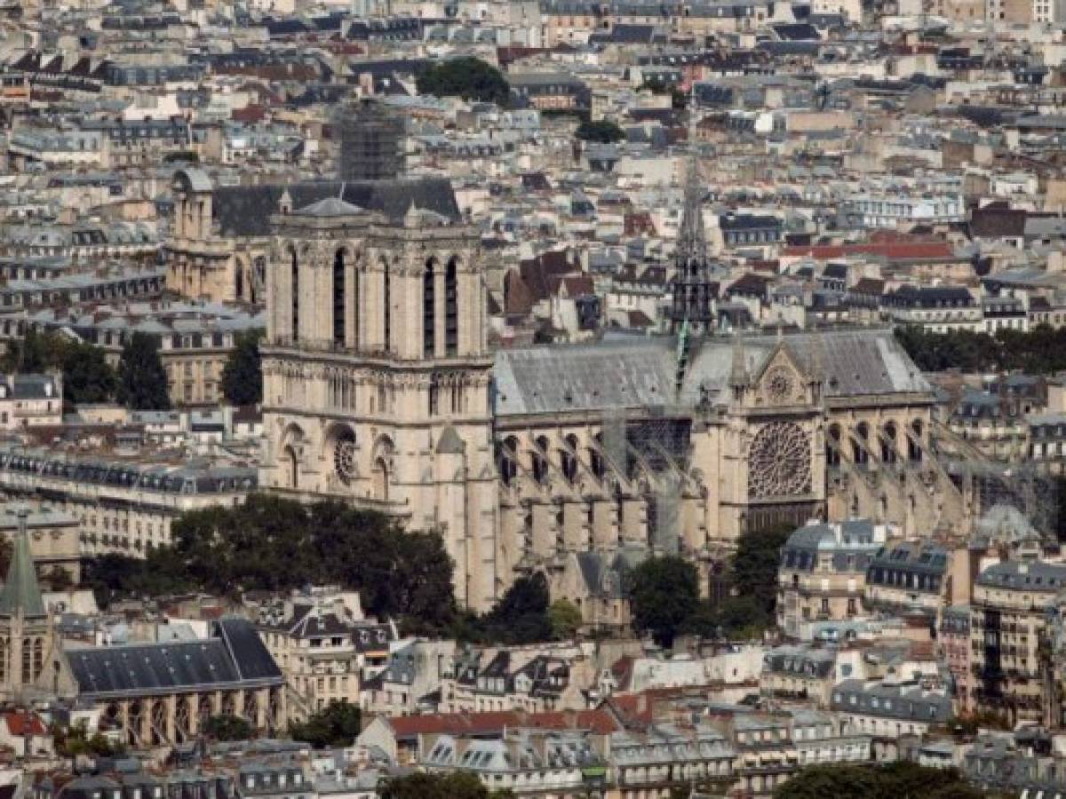 (FILES) A file photo taken on July 15, 2018 shows the Notre-Dame de Paris Cathedral, in the French capital Paris. - A fire broke out at the landmark Notre-Dame Cathedral in central Paris on April 15, 2019 afternoon, potentially involving renovation works being carried out at the site, the fire service said. (Photo by Thomas SAMSON / AFP) (FILES) A file photo taken on July 15, 2018 shows the Notre-Dame de Paris Cathedral, in the French capital Paris. - A fire broke out at the landmark Notre-Dame Cathedral in central Paris on April 15, 2019 afternoon, potentially involving renovation works being carried out at the site, the fire service said. (Photo by Thomas SAMSON / AFP)
