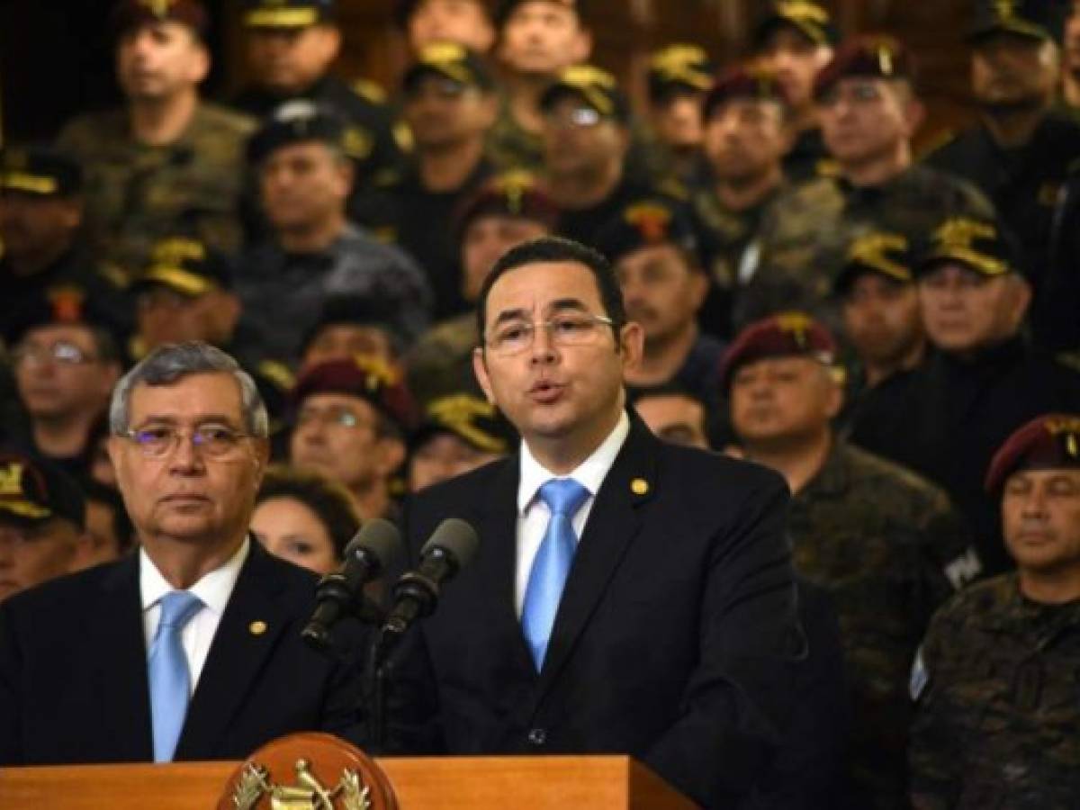 Guatemalan President Jimmy Morales delivers a press conference in Guatemala City on August 31, 2018.Morales announced Friday Guatemala will not renew the mandate of a UN anti-corruption mission, which he accused of improper interference on internal matters of the country. / AFP PHOTO / ORLANDO ESTRADA