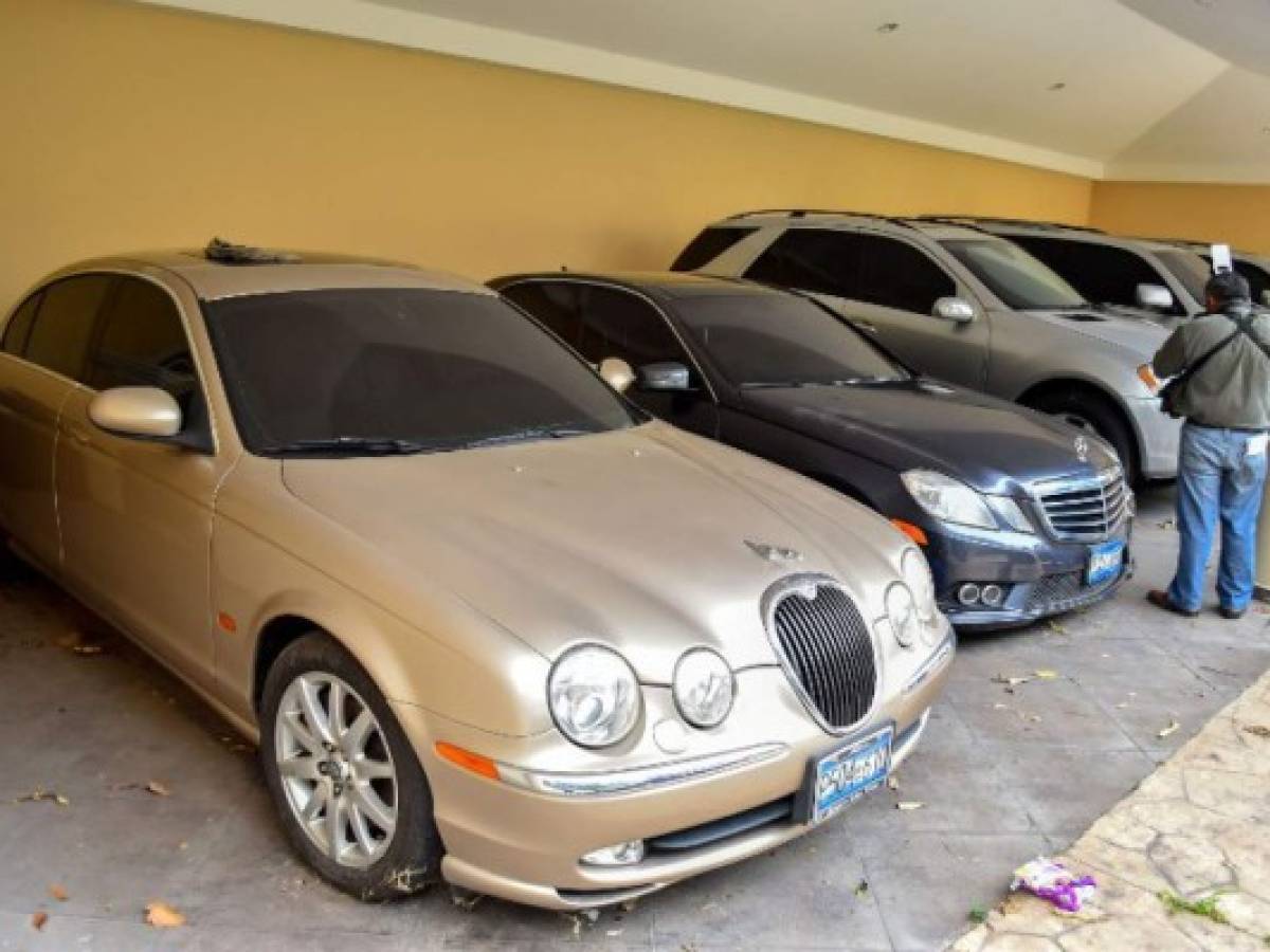 Picture of vehicles which were confiscated from Salvadorean former president (2004-2009), Elias Antonio Saca, in San Salvador, taken on August 10, 2018.The Attorney General's Office of Salvador announced on August 10, 2019 the confiscation of Saca's several properties and assets. The former president pleaded guilty in court in July for crimes of embezzlement and money laundering during his government in exchange for an abbreviated trial and the reduce of his prison sentence. Saca and six ex-administration officials are on trial for embezzling $301 million in public funds. / AFP PHOTO / Oscar Rivera