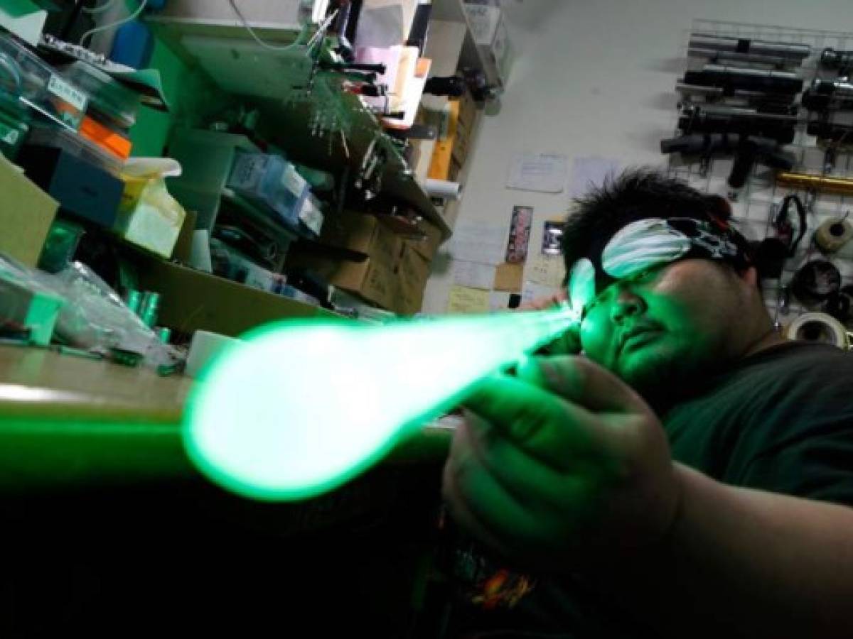 In this picture taken on April 22, 2019, Makoto Tsai, who handcrafts lightsabers for Star Wars fans, poses for a photograph at his workshop in New Taipei City. - Frustrated by the lack of quality lightsabers in toy shops, Makoto Tsai did what any self-respecting hardcore Star Wars fan would do -- he studied engineering at college and then spent years perfecting a replica. (Photo by HSU Tsun-hsu / AFP) / To go with AFP story 'Taiwan culture movie StarWars', FEATURE by Amber Wang In this picture taken on April 22, 2019, Makoto Tsai, who handcrafts lightsabers for Star Wars fans, poses for a photograph at his workshop in New Taipei City. - Frustrated by the lack of quality lightsabers in toy shops, Makoto Tsai did what any self-respecting hardcore Star Wars fan would do -- he studied engineering at college and then spent years perfecting a replica. (Photo by HSU Tsun-hsu / AFP) / To go with AFP story 'Taiwan culture movie StarWars', FEATURE by Amber Wang