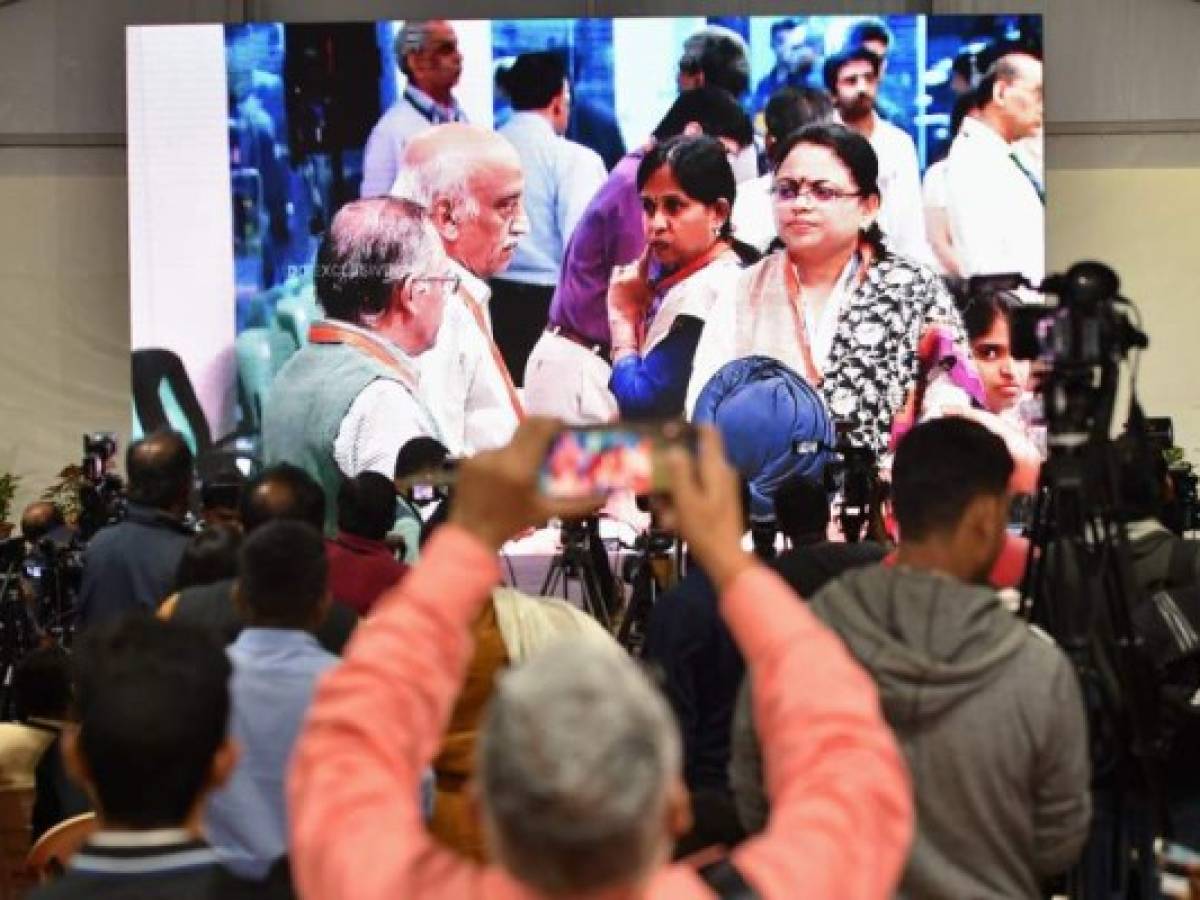 Indian Space Research Organisation (ISRO) employees gather to watch the live broadcast of the soft landing of spacecraft Vikram Lander of Chandrayaan-2 on the surface of the Moon at ISRO Telemetry, Tracking and Command Network (ISTRAC) centre in Bangalore early on September 7, 2019. - India lost communication with its unmanned spacecraft on September 7 just before it was due to land on the Moon, in a major setback to the country's lunar ambitions amid renewed interest in Earth's satellite. (Photo by Manjunath Kiran / AFP)