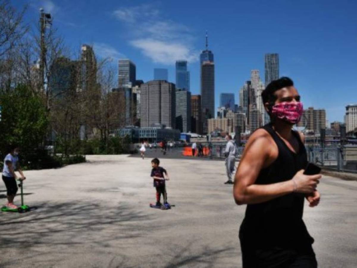 NEW YORK, NY - MAY 02: People keep their personal distance as they enjoy a spring afternoon in Brooklyn Bridge Park on May 02, 2020 in the Brooklyn borough of New York City. New York City, which has been the hardest hit city in America from COVID-19, is starting to see a slowdown in hospital visits and a lowering of the daily death rate from the virus. Spencer Platt/Getty Images/AFP