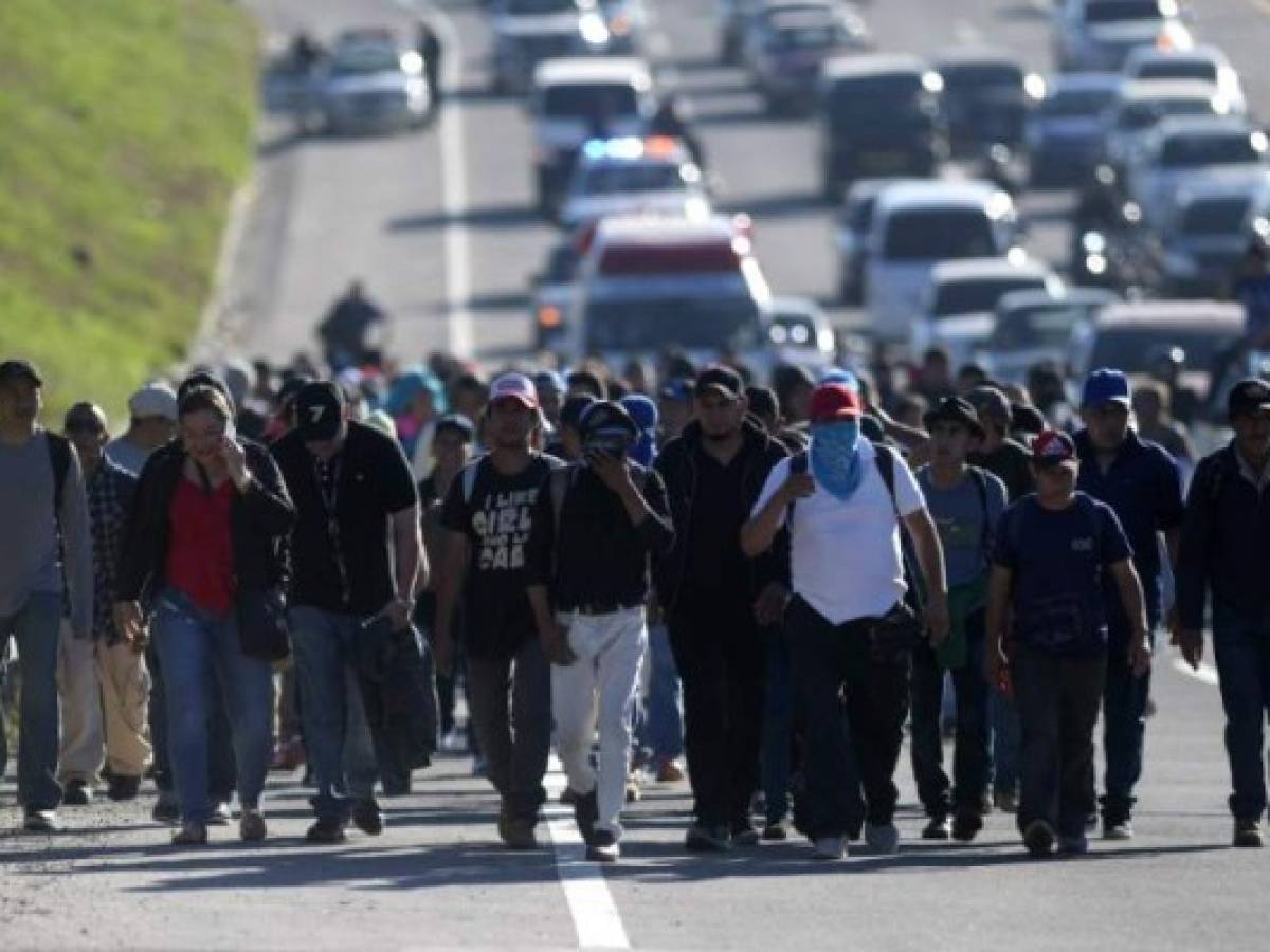 A group of Salvadoran migrants start their journey towards the United States in San Salvador, on January 16, 2019. - A new caravan of some 200 Salvadorans, left Wednesday from San Salvador aiming to reach the United States. (Photo by MARVIN RECINOS / AFP)