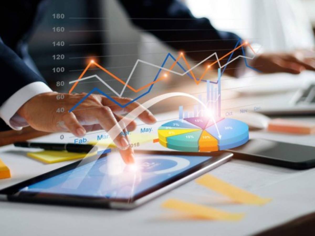 Businessman using tablet and laptop analyzing sales data and economic growth graph chart. Business strategy. Digital marketing. Business innovation technology concept