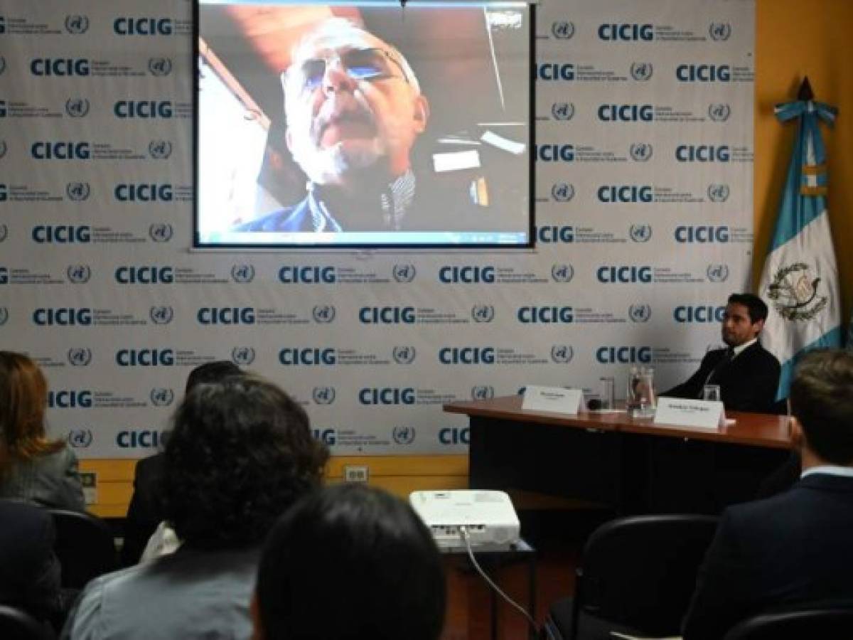 The head of the International Commission Against Impunity in Guatemala (CICIG), Colombian Ivan Velasquez, is seen on a screen during the presentation of a report entitled 'Guatemala, a Captured State', in Guatemala City on August 28,2019. - The Cicig's mandate comes to an end next Tuesday after President Jimmy Morales broke his promise to extend its mandate for two more years. (Photo by Johan ORDONEZ / AFP)