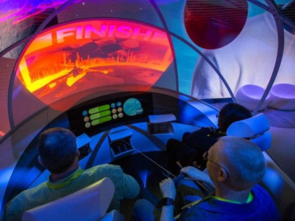 EDITORS NOTE: Graphic content / People practice rowing in a demonstration of the Hyundai My I.A. system of passenger entertainment in autonomous vehicles at the Las Vegas Convention Center during CES 2019 on January 9, 2019. (Photo by DAVID MCNEW / AFP) EDITORS NOTE: Graphic content / People practice rowing in a demonstration of the Hyundai My I.A. system of passenger entertainment in autonomous vehicles at the Las Vegas Convention Center during CES 2019 on January 9, 2019. (Photo by DAVID MCNEW / AFP)