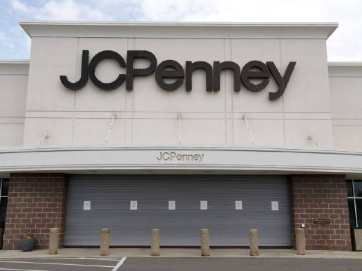 A parking lot at a JC Penney store is empty in Roseville, Mich., Friday, May 8, 2020. Across the country, in industries of every kind and size, the coronavirus pandemic has devastated businesses small and large. (AP Photo/Paul Sancya)