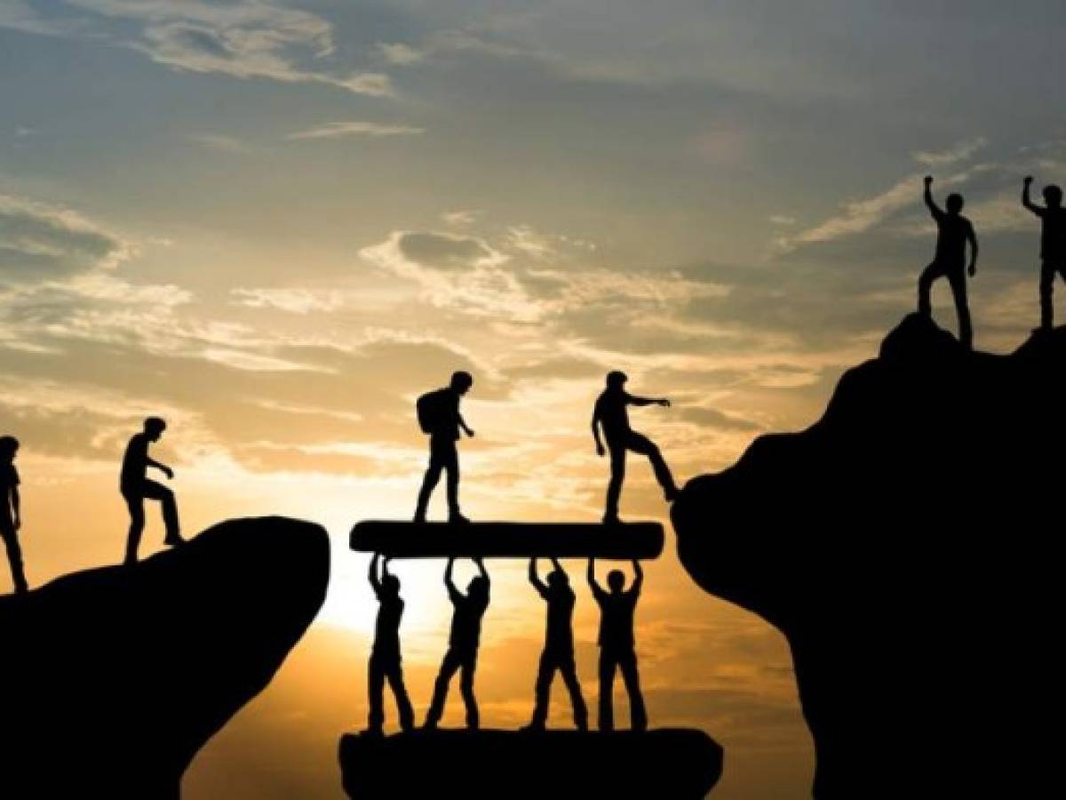 Group of people on peak mountain climbing helping team work , travel trekking success business concept Group of people on peak mountain climbing helping team work , travel trekking success business concept