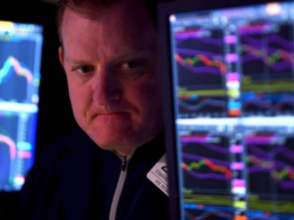Traders work during the opening bell at the New York Stock Exchange (NYSE) on February 28, 2020 at Wall Street in New York City. - Losses on Wall Street deepened following a bruising open, as global markets were poised to conclude their worst week since 2008 with another rout. (Photo by Johannes EISELE / AFP) Traders work during the opening bell at the New York Stock Exchange (NYSE) on February 28, 2020 at Wall Street in New York City. - Losses on Wall Street deepened following a bruising open, as global markets were poised to conclude their worst week since 2008 with another rout. (Photo by Johannes EISELE / AFP)