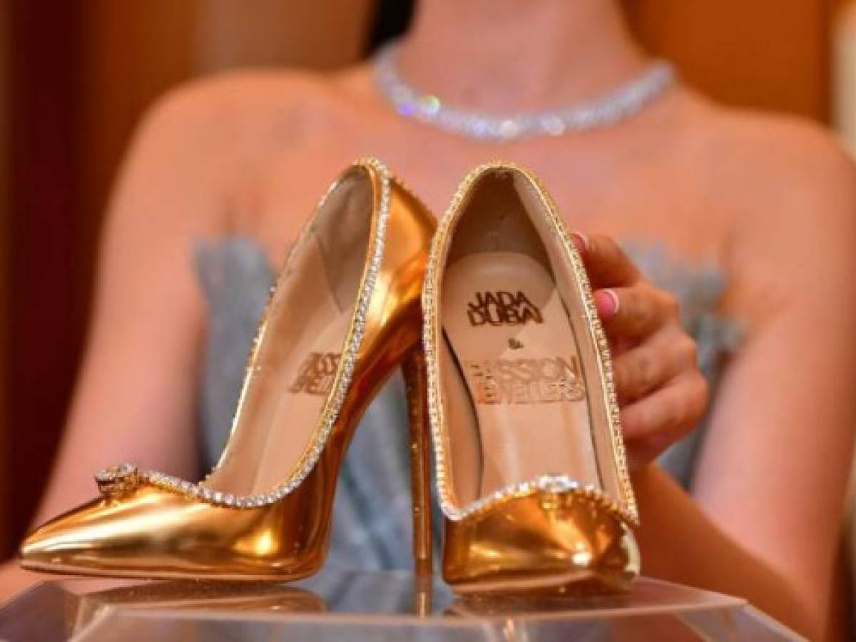 A pair of shoes worth 17 million US dollars are seen on display at Burj Al Arab during the launch presentation in Dubai on September 26, 2018.The Passion Diamond Shoes, features hundreds of diamonds, together with two imposing D-flawless diamonds of 15 carats each. / AFP PHOTO / GIUSEPPE CACACE A pair of shoes worth 17 million US dollars are seen on display at Burj Al Arab during the launch presentation in Dubai on September 26, 2018.The Passion Diamond Shoes, features hundreds of diamonds, together with two imposing D-flawless diamonds of 15 carats each. / AFP PHOTO / GIUSEPPE CACACE