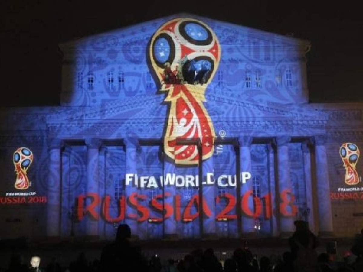 Russian supporters celebrate Russia's second goal while watching the Russia 2018 World Cup Group A football match between Russia and Saudi Arabia in the fan zone near the main building of the Moscow State University in Moscow on June 14, 2018. / AFP PHOTO / Maxim ZMEYEV Russian supporters celebrate Russia's second goal while watching the Russia 2018 World Cup Group A football match between Russia and Saudi Arabia in the fan zone near the main building of the Moscow State University in Moscow on June 14, 2018. / AFP PHOTO / Maxim ZMEYEV
