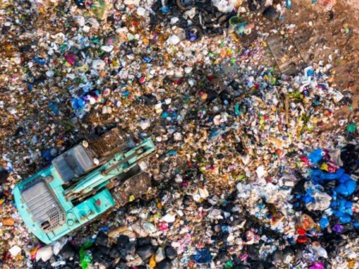 Ecosystem and healthy environment concepts and background, Garbage pile in trash dump or landfill, Aerial view garbage trucks unload garbage to a landfill, global warming.