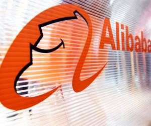 A logo of the Chinese multinational e-commerce, retail, internet, and technology conglomerate, Alibaba group, is pictured on a window of a stand during the Vivatec trade fair (Viva Technology), on May 24, 2018, in Paris. (Photo by ALAIN JOCARD / AFP)
