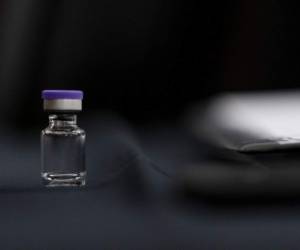 WASHINGTON, DC - DECEMBER 10: An example of the Pfizer COVID-19 vaccine vial is visible on a desk before a Senate Transportation subcommittee hybrid hearing on transporting a coronavirus vaccine on Capitol Hill, on December 10, 2020 in Washington, DC. Andrew Harnik-Pool/Getty Images/AFP