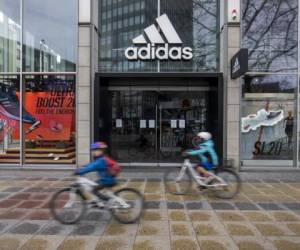 One of German sporting goods company Adidas outlets is pictured in Berlin on March 29, 2020. - Major retailers in Germany say they plan to stop paying rent for stores that were told to close in order to slow the pandemic. Adidas is leading the charge, along with shoe chain Deichmann and Swedish clothing giant H&M. (Photo by Odd ANDERSEN / AFP)