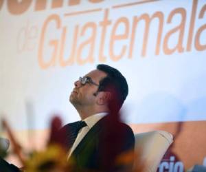 Guatemalan President Jimmy Morales speaks attends a meeting with businessmen in Guatemala City on January 26, 2016. Morales explained his plans to combat violence and how he will manage public resources. AFP PHOTO / Johan ORDONEZ / AFP / JOHAN ORDONEZ