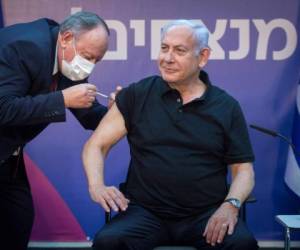 Israeli Prime Minister Minister Benjamin Netanyahu receives the second dose of the coronavirus disease (COVID-19) vaccine at Sheba Medical Center in Ramat Gan, near the coastal city of Tel Aviv, on January 9, 2021. (Photo by Miriam ALSTER / POOL / AFP)