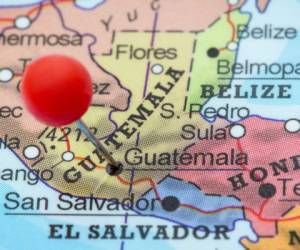 Close-up of a red pushpin in a map of Guatemala (City), Guatemala.