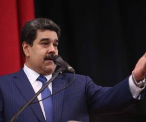 Handout picture released by the Venezuelan presidency showing Venezuelan President Nicolas Maduro talking during the graduation ceremony of a Cuba-Venezuela cooperation agreement, in Caracas on November 1, 2018. - The White House imposed 'tough' new sanctions against Venezuela on Thursday, denouncing Caracas as being part of a 'troika of tyranny' that includes Cuba and Nicaragua. National Security Advisor John Bolton said that the sanctions would particularly target Venezuela's gold sector, which 'has been used as a bastion to finance illicit activities, to fill its coffers and to support criminal groups.' (Photo by Francisco Batista / Venezuelan Presidency / AFP) / RESTRICTED TO EDITORIAL USE - MANDATORY CREDIT 'AFP PHOTO / VENEZUELAN PRESIDENCY / FRANCISCO BATISTA / HO' - NO MARKETING NO ADVERTISING CAMPAIGNS - DISTRIBUTED AS A SERVICE TO CLIENTS