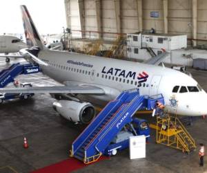 The Airbus A319 operated by LATAM Airlines which will transport Pope Francis during his upcoming visit to Peru is pictured at a hangar before its official presentation in Callao, Peru on January 16, 2018. - Pope Francis is visiting Chile from January 15 to 18, before heading to Peru from January 18 to 21, where he will visit the cities of Lima, Trujillo and Puerto Maldonado. (Photo by LUKA GONZALES / AFP)