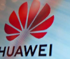 A Huawei logo is seen on a screen during the Mobile World Congress (MWC 2019) introducing next-generation technology at the Shanghai New International Expo Centre (SNIEC) in Shanghai on June 26, 2019. (Photo by Hector RETAMAL / AFP)