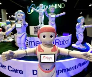 LAS VEGAS, NV - JANUARY 10: A chorus of iPal robots sing for attendees at the AvatarMind booth during CES 2018 at the Las Vegas Convention Center on January 10, 2018 in Las Vegas, Nevada. CES, the world's largest annual consumer technology trade show, runs through January 12 and features about 3,900 exhibitors showing off their latest products and services to more than 170,000 attendees. David Becker/Getty Images/AFP