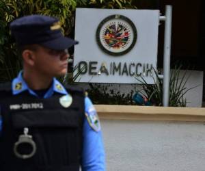 El presidente, Juan Orlando Hernández, dio el anuncio luego que el Gobierno no ratificó la continuidad de la Misión de Apoyo Contra la Corrupción y la Impunidad en Honduras (Maccih) con la OEA. Foto ORLANDO SIERRA / AFP
