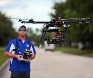 ReadyHeli.com technician and sales agent Brett Strand operates his own personal octacopter drone in Jupiter, Fla., Dec. 4, 2013. (Richard Graulich/Palm Beach Post/MCT)