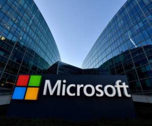(FILES) In this file photo taken on March 5, 2018 the logo of French headquarters of American multinational technology company Microsoft, is pictured in Issy-Les-Moulineaux, a Paris suburb. - Microsoft on October 27 said its profit in the recently ended quarter continued to soar as the pandemic boosted a trend toward business being taken care of in the internet cloud.The US technology titan's profit rose to $13.9 billion, up 30 percent from the same quarter last year, according to earnings figures. (Photo by GERARD JULIEN / AFP)