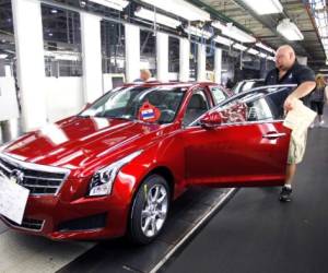 LANSING, MI, - JULY 26: A General Motors' worker assembles a 2013 Cadillac ATS on the assembly line at the General Motors Lansing Grand River Assembly Plant July 26, 2012 in Lansing, Michigan. The first 2013 Cadillac ATS available for retail sale rolled off the assembly line today at the plant. Bill Pugliano/Getty Images/AFP