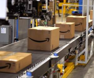 AURORA, CO - MAY 03: Packed orders move down a converyor belt at the Amazon fullfillment center May 3, 2018 in Aurora, Colorado. The million square foot facility, employing 1,000 fulltime employees, has over 2 million products ready to ship to customers globally. Rick T. Wilking/Getty Images/AFP