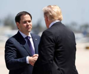 U.S. President Donald Trump is greeted by Senator Marco Rubio (R-FL) upon his arrival in Miami, Florida, U.S., April 16, 2018. REUTERS/Kevin Lamarque - RC1162E16B90