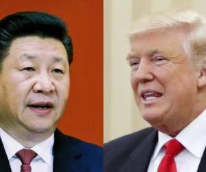 (FILES) In this file photo taken on November 9, 2017 China's President Xi Jinping shakes hands with US President Donald Trump (L) during a business leaders event at the Great Hall of the People in Beijing. - US President Donald Trump said June 18, 2019 he had a positive phone conversation with his Chinese counterpart Xi Jinping and that they will hold an 'extended meeting' next week at the G20 summit. Trump's tweet set a more upbeat tone for his talks with Xi at the summit in Japan after growing questions over whether the world's two leading economies will be able to resolve their differences and end a huge trade war.'Had a very good telephone conversation with President Xi of China. We will be having an extended meeting next week at the G-20 in Japan. Our respective teams will begin talks prior to our meeting,' Trump said. (Photo by Nicolas ASFOURI / AFP)