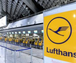 Deserted check-in desks of German airline Lufthansa are seen at the airport in Frankfurt am Main, western Germany, on November 7, 2019, as cabin crews kicked off a strike. - Tens of thousands of Lufthansa passengers faced disruptions as cabin crew in Germany started to stage a 'massive' 48-hour walkout in the biggest escalation yet of a bitter row over pay and conditions. (Photo by Silas Stein / dpa / AFP) / Germany OUT