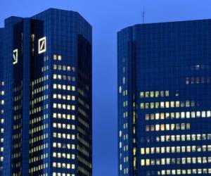 A picture taken on July 6, 2019 shows a view of the headquarters of German bank 'Deutsche Bank' in Frankfurt am Main, western Germany. - Germany's leading bank Deutsche Bank warned on July 7, 2019 that it would incur a large net loss of 2.8 billion in the second quarter of the current financial year due to charges related to a major restructuring plan. (Photo by Boris Roessler / dpa / AFP) / Germany OUT