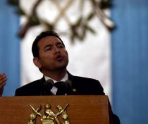Guatemalan President Jimmy Morales delivers his second annual State of the Nation address to Congress in Guatemala City on January 14, 2018. - Guatemalan President Jimmy Morales, under suspicion of receiving illegal financing for his campaign in 2015, stated on Sunday, at the end of his second year in office, that his administration has fought for transparency and against corruption. (Photo by ORLANDO ESTRADA / AFP)